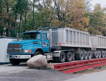 Thurman 8100 portable mechanical truck scale, 3/8 in welded steel tread-plate deck on a steel sub-frame over concrete piers