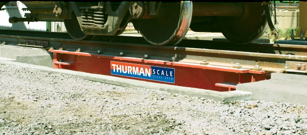 Railcar wheels on a Thurman 8765 above-ground railroad track scale