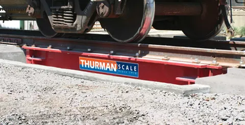 Thurman 8765 RRT above-ground railroad track scale module, live rail on the main girders with steel deck cover panels.