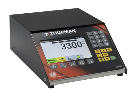 TS3301 analog scale indicator, NEMA 12 desktop housing, 7-inch color display and numeric keypad.